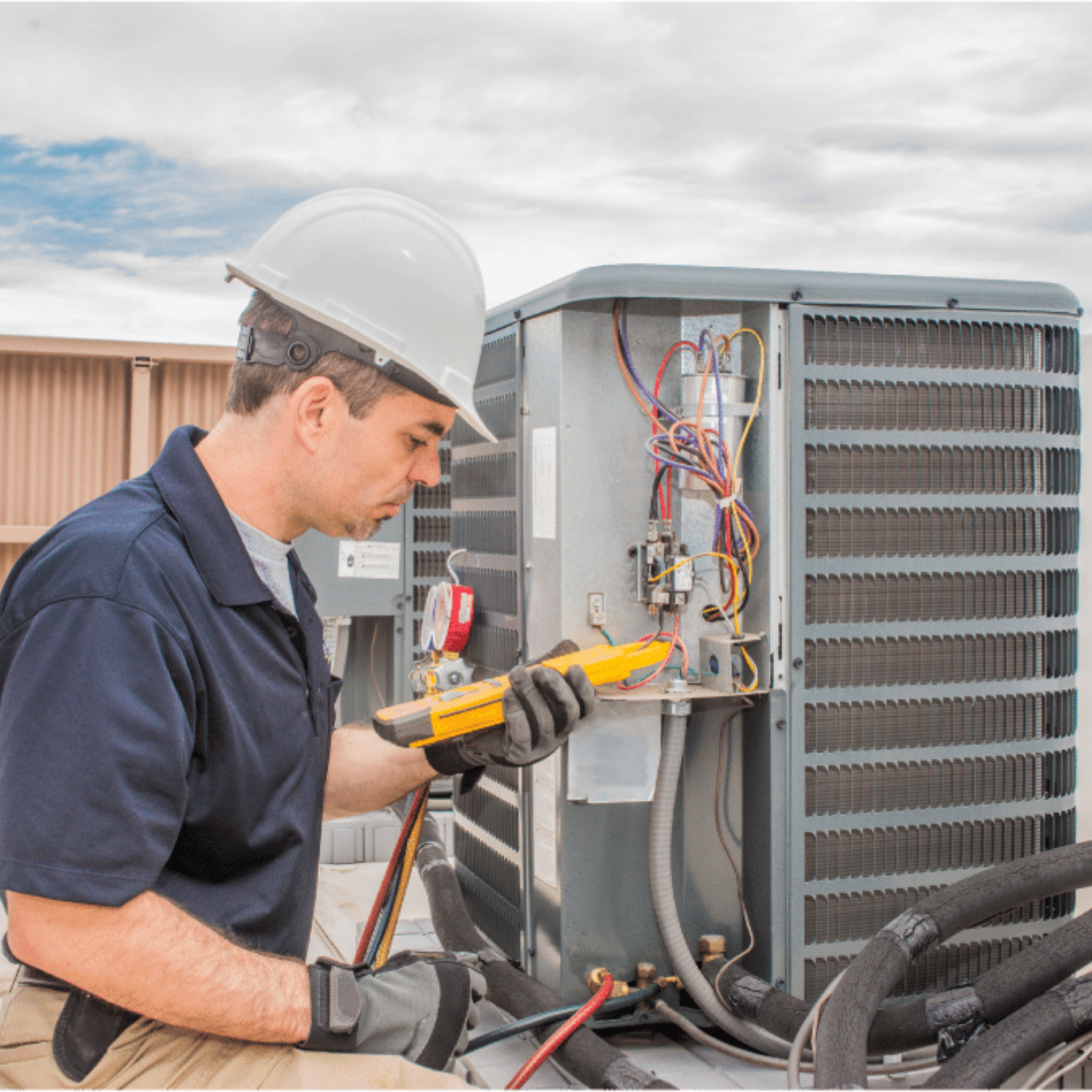 Simcoe Heating & Cooling HVAC technician servicing a system